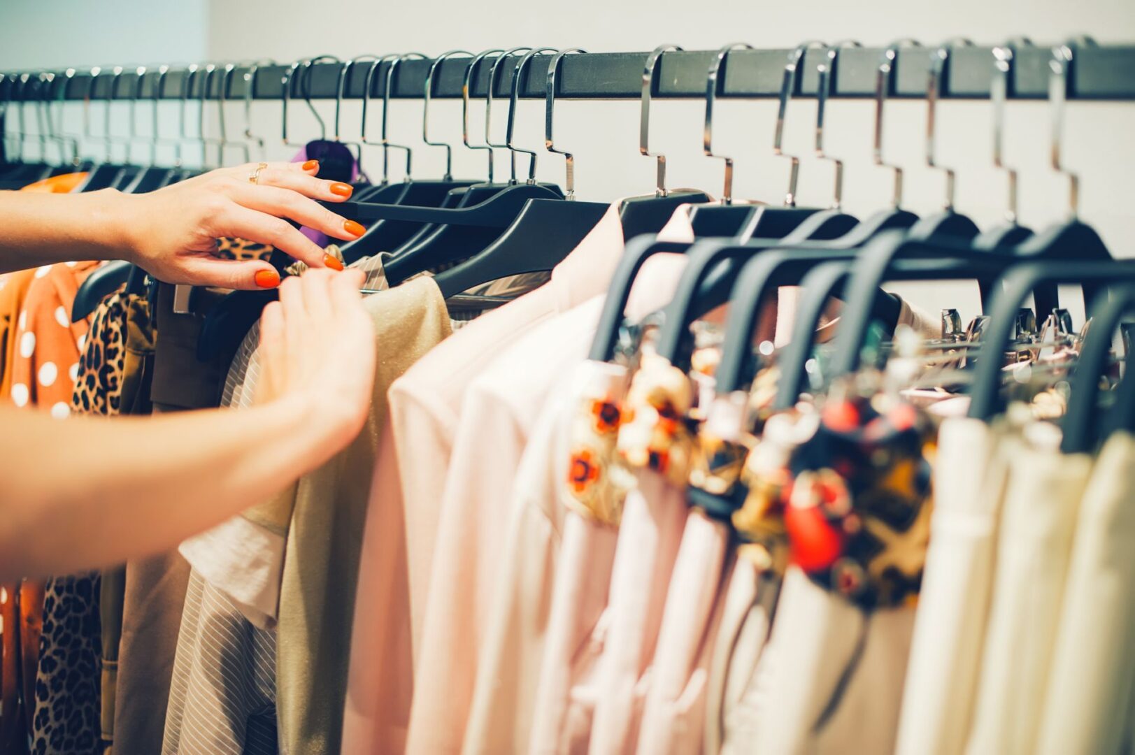 Woman's hands selecting clothes