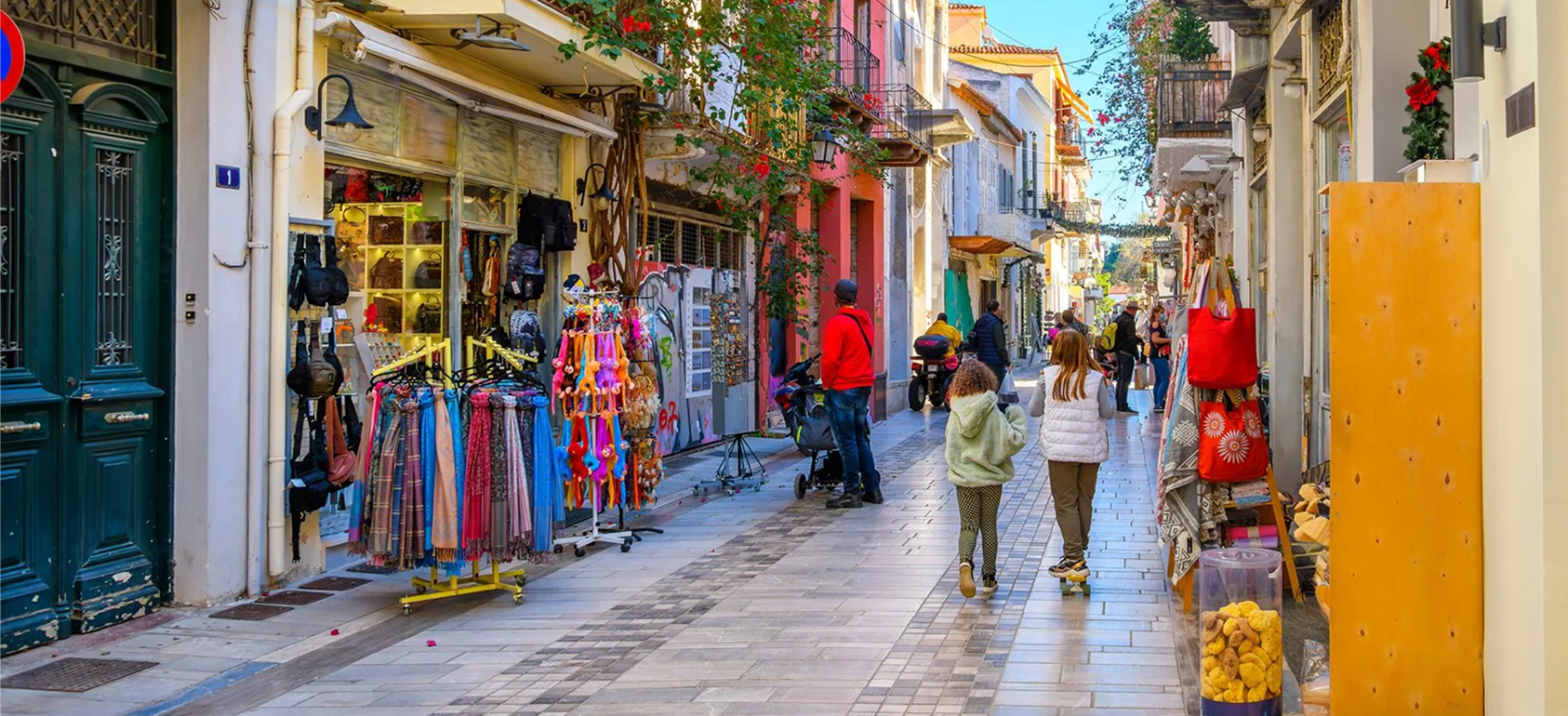 Colorful street with shops and pedestrians