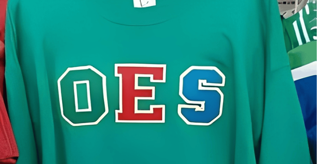 Green shirt with OES lettering